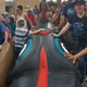 Here are people touching the totem pole as it makes its way to Florida.